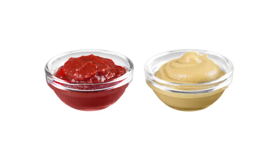 Assorted liquid foods including tomato sauce, barbecue sauce, fruit puree, and salad dressing in containers