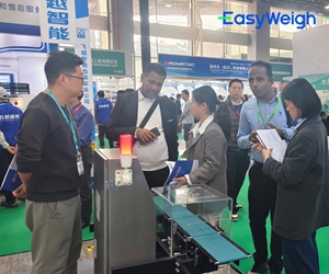 EasyWeigh engineer providing on-site installation guidance for dynamic checkweigher at customer facility