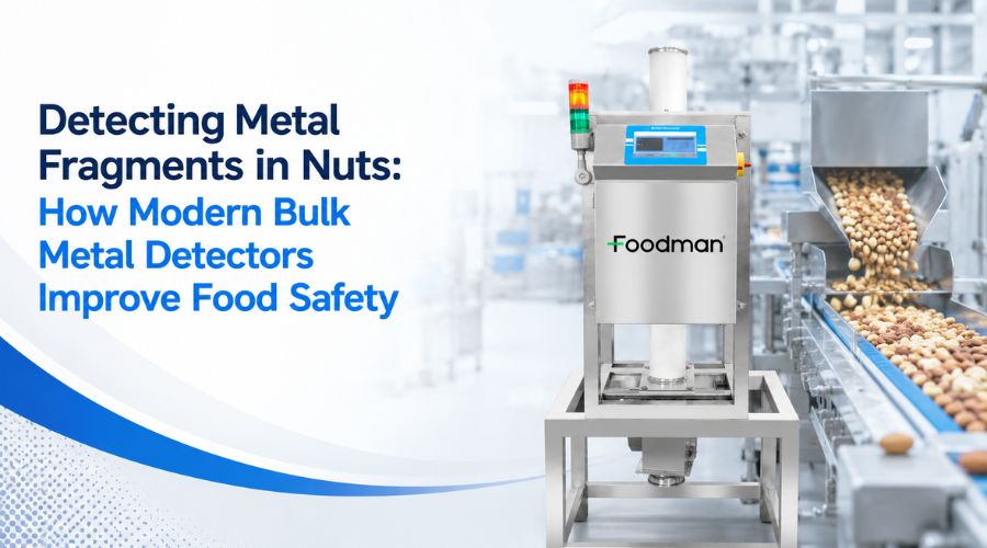 Modern bulk metal detector inspecting mixed nuts on high-speed conveyor for metal fragment contamination in food processing