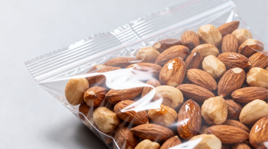 Finished nut packaging with quality certification mark indicating passed metal detection and vision inspection