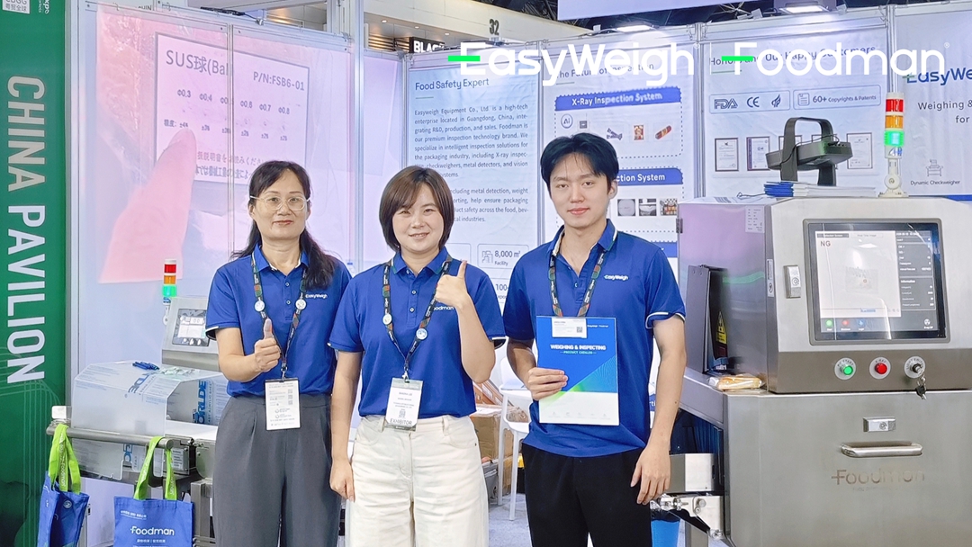 Group photo of EasyWeigh and Foodman team members at PROPACK ASIA 2026 booth