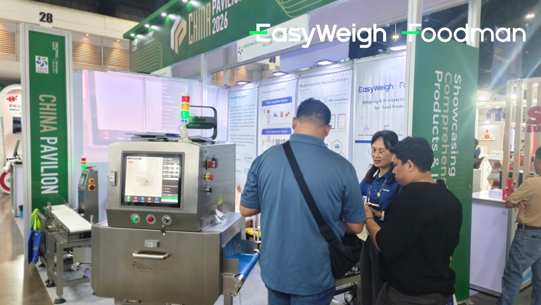 Technical staff demonstrating inspection system operation to potential customers at PROPACK ASIA 2026
