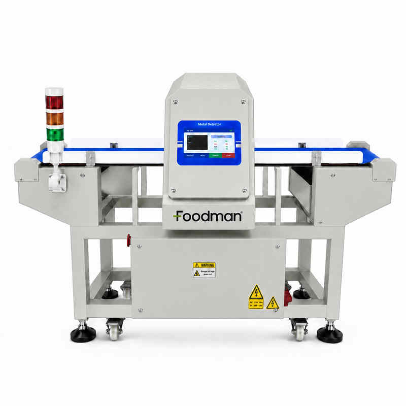 Conveyor metal detector scanning packaged products on production line for metal contaminants
